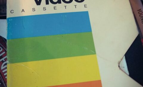 A Polaroid recordable VHS tape with rainbow stripes.